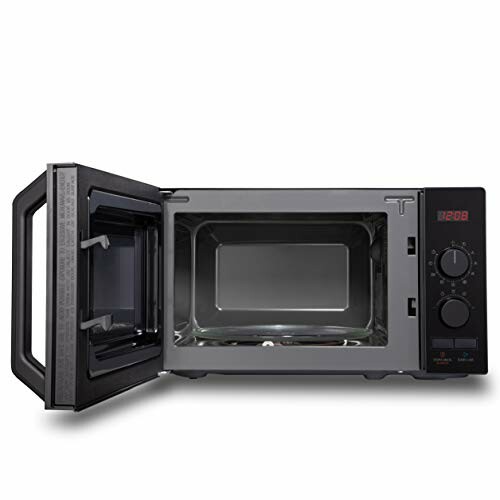 Black microwave oven with open door and digital display