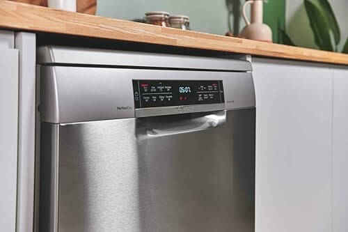 Modern stainless steel dishwasher with digital control panel