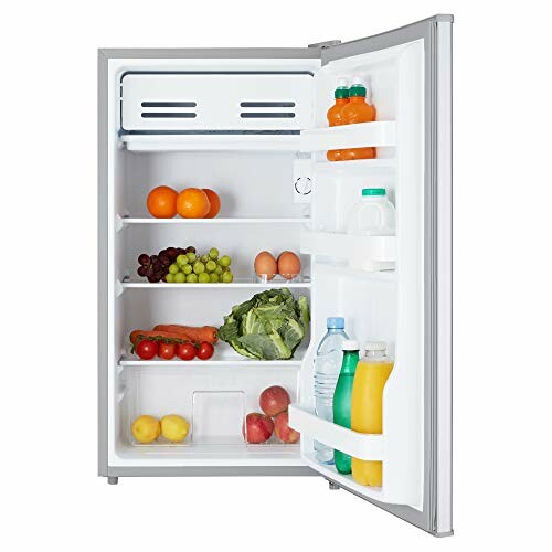 Open refrigerator with fruits, vegetables, and drinks inside.