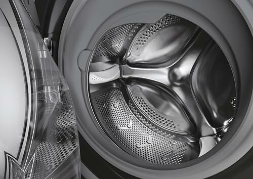 Open washing machine drum with stainless steel interior