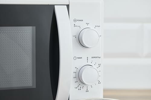 White microwave control panel with dials